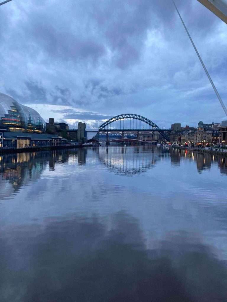 An image taken from a bridge over the Tyne, overlooking the Tyne bridge in Newcastle where you can access addiction treatment in Newcastle.