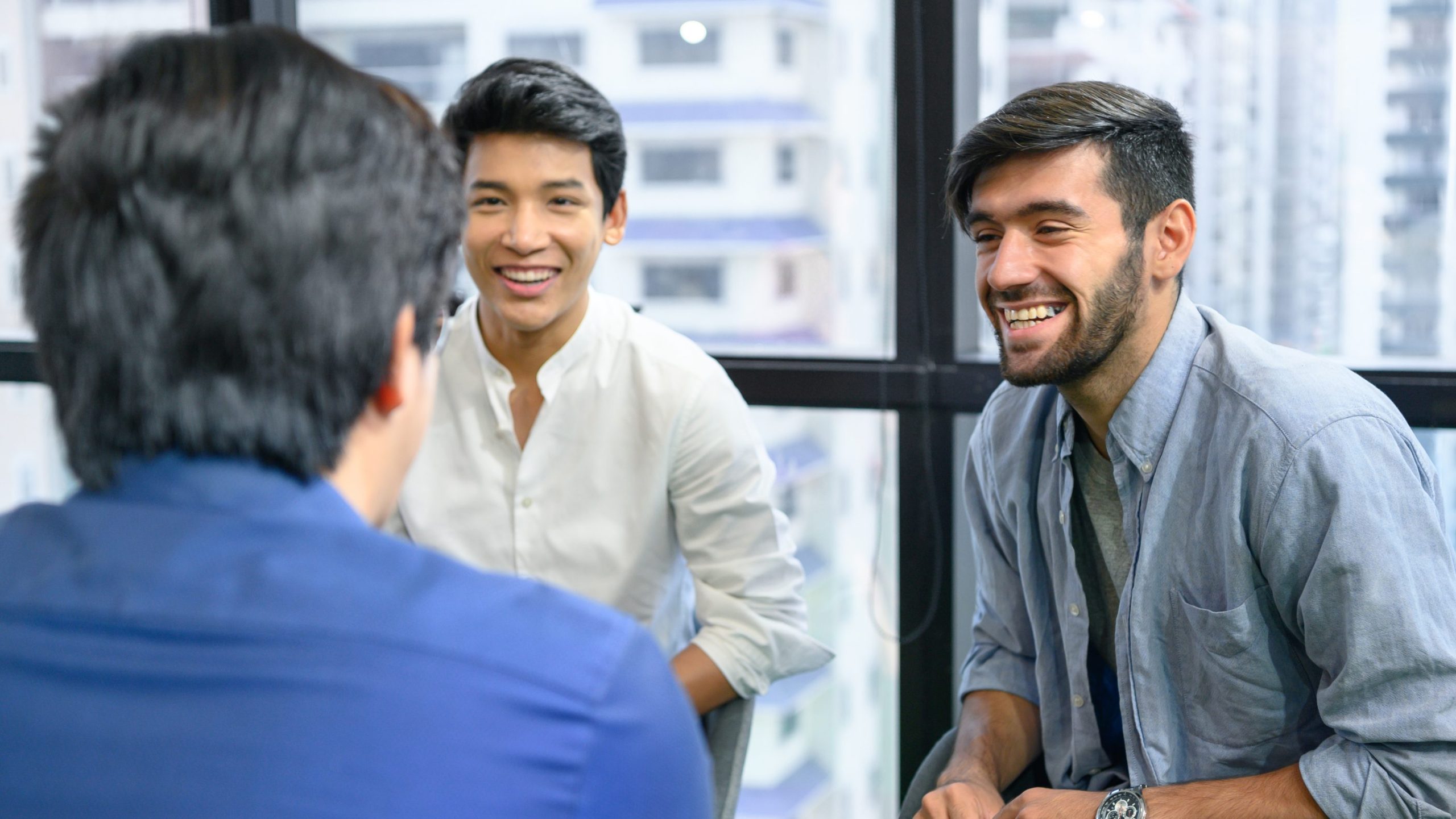 Psychotherapist inquiring about symptoms occurring within mind from patients with mental health problems in hospital. Group psychotherapy for support and helping worried man to change negative mindset