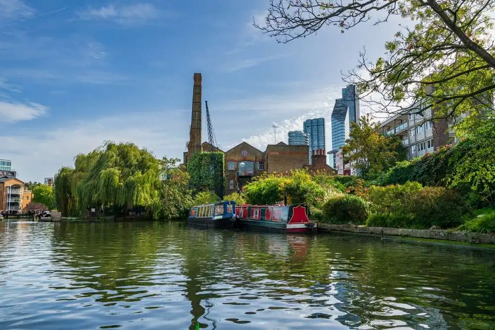 a view of regent's canal with islington, london as the backdrop where you will find addiction treatment and rehab in islington