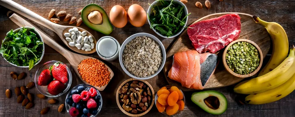 A range of foods including meat, fish, grains, pulses, vegetables and fruit as part of a healthy or balanced diet.
